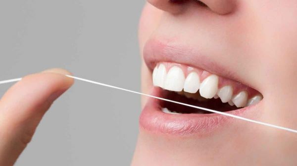 importancia-usar-hilo-dental importancia de usar hilo dental